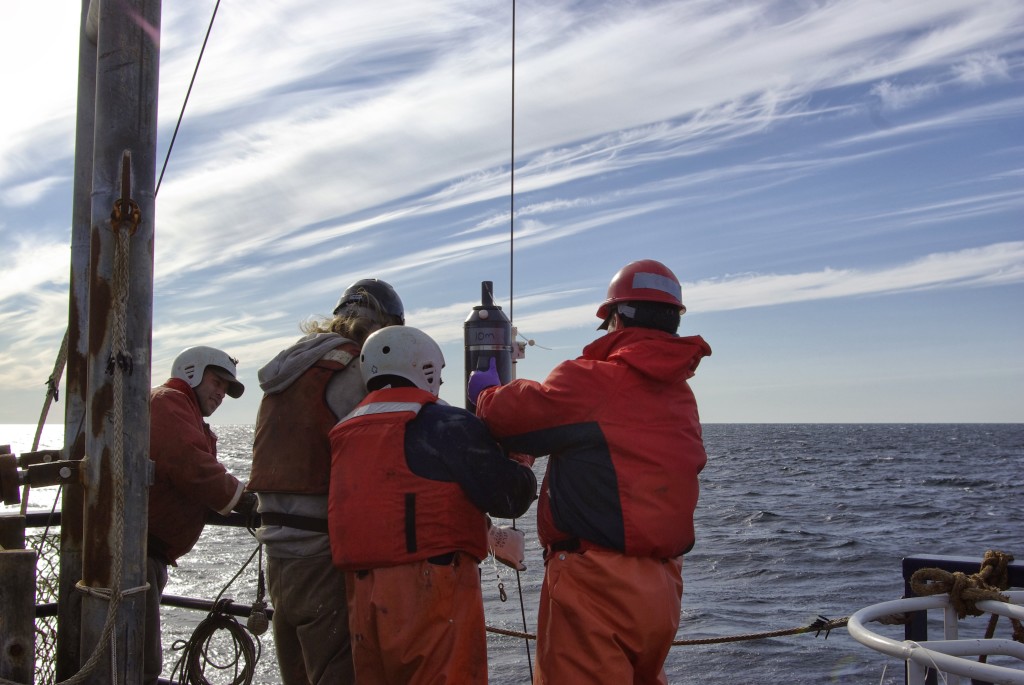 Boat and science crew attaching Niskin bottle to winch line_photoStacyVega
